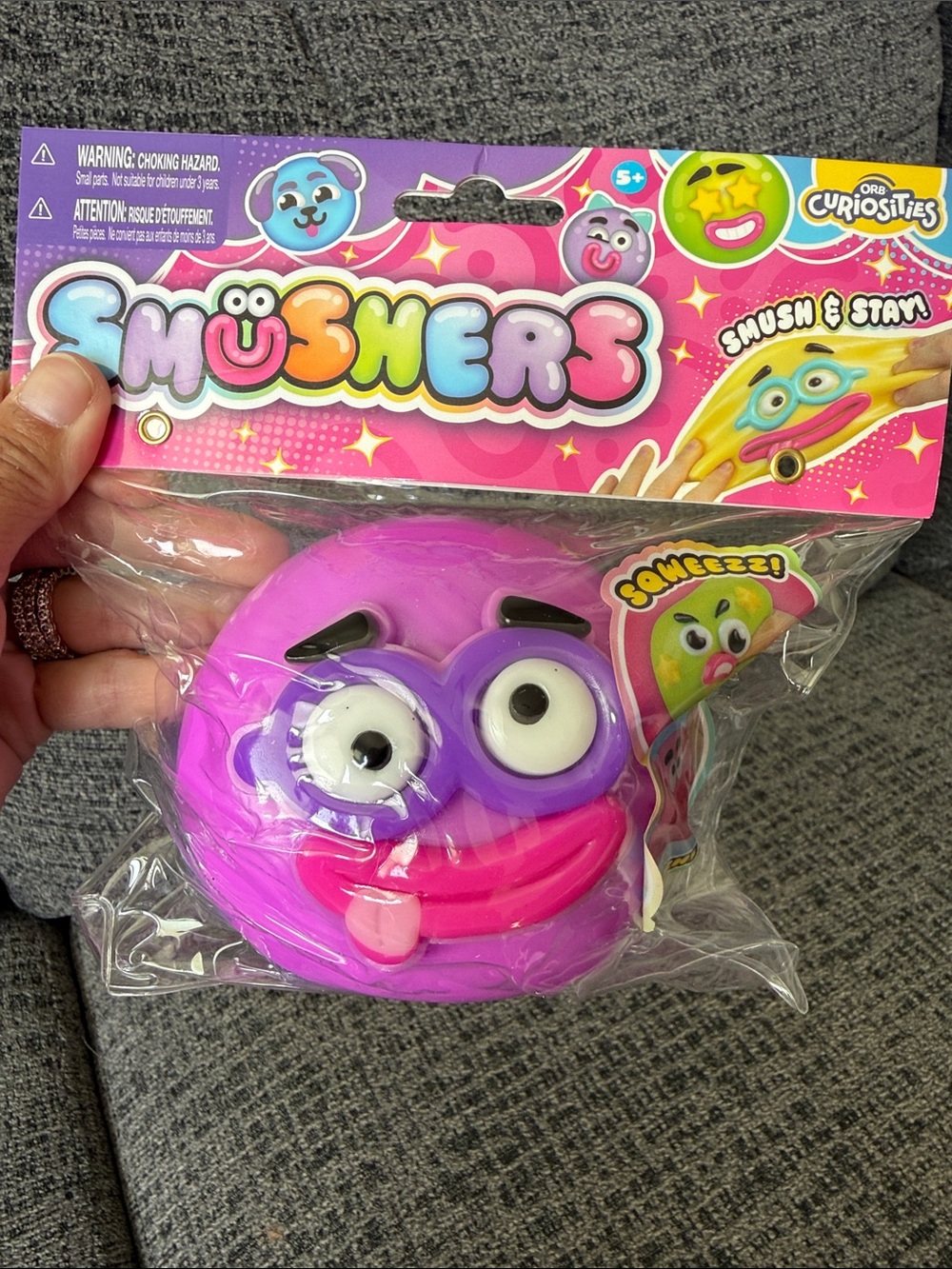 BNIB ORB Curiosities SMUSHERS Squishy, Purple Face w/Purple Glasses